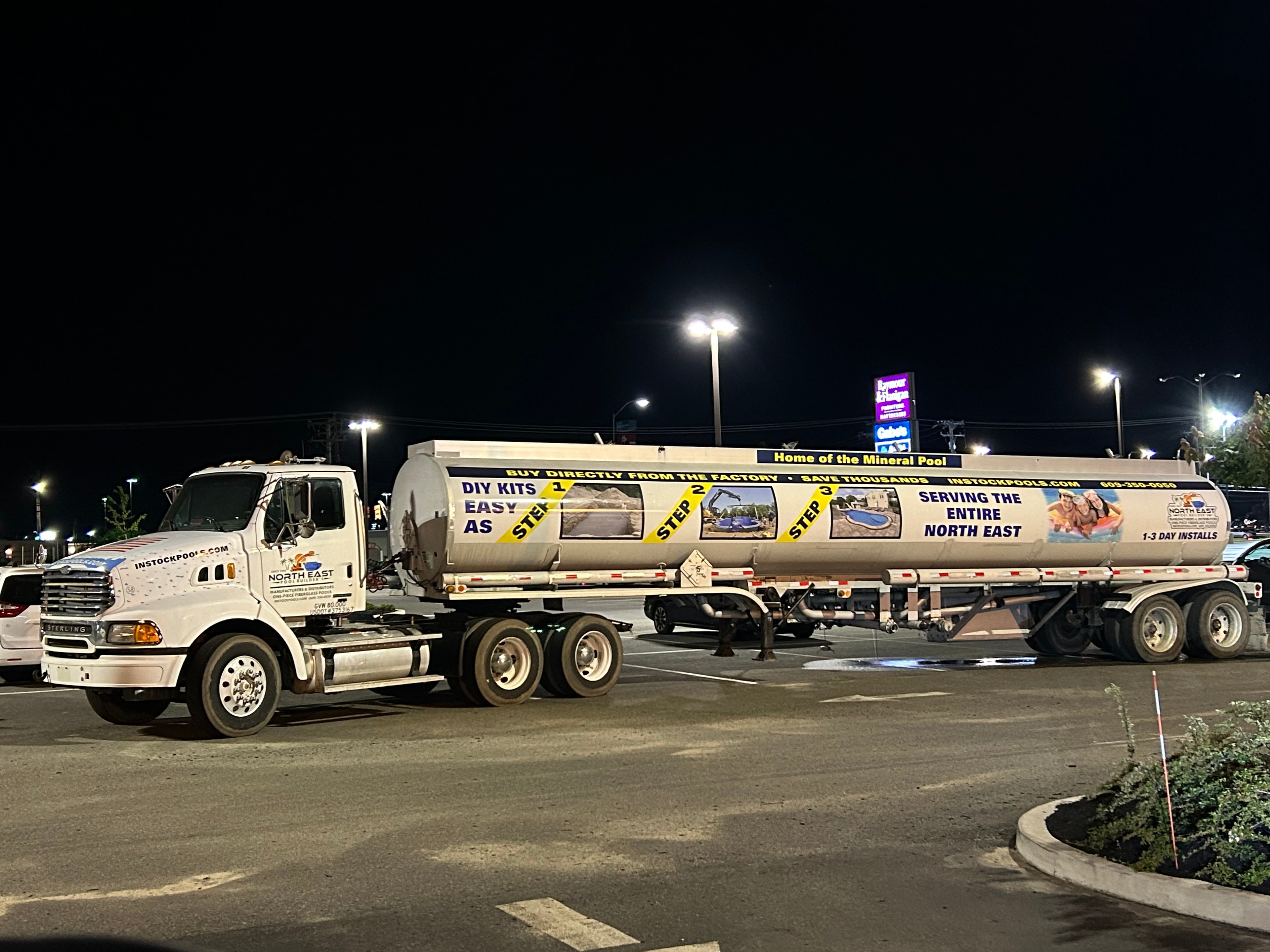 North East Pool Distributors water tanker truck at night